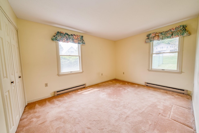 6 Seaside Dr, Belfast, ME 04915 - unfurnished bedroom featuring baseboard heating, multiple windows, and carpet flooring