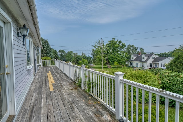 6 Seaside Dr, Belfast, ME 04915 - wooden deck with a lawn and view of wooded area