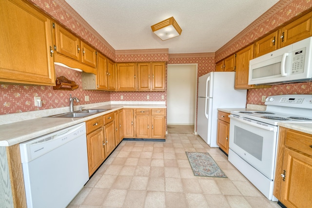 6 Seaside Dr, Belfast, ME 04915 - kitchen with white appliances, wallpapered walls, light countertops, and brown cabinetry
