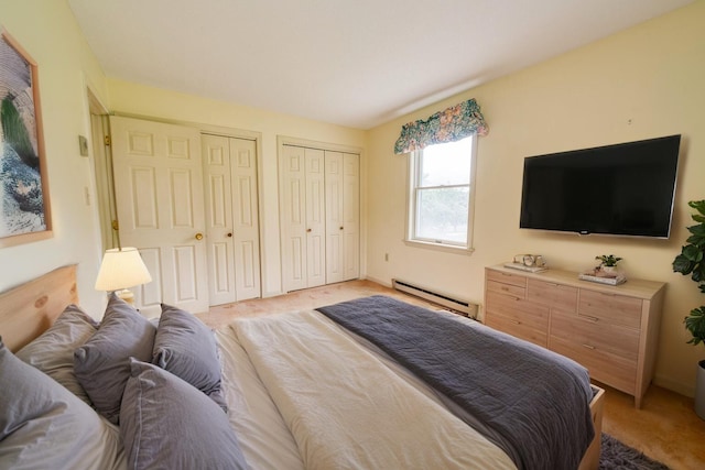6 Seaside Dr, Belfast, ME 04915 - bedroom with a baseboard radiator, two closets, and light carpet