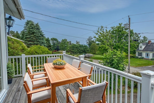 6 Seaside Dr, Belfast, ME 04915 - deck with outdoor dining space and view of scattered trees
