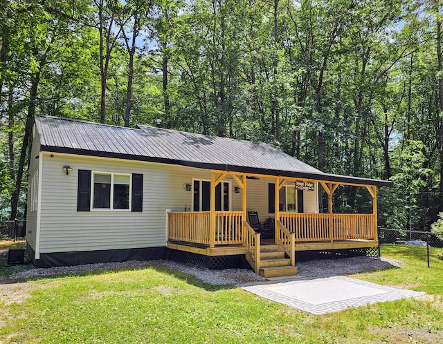137 Maplewood Dr, Naples, ME 04055 - view of front of property featuring metal roof and covered porch