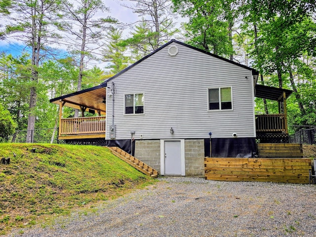 137 Maplewood Dr, Naples, ME 04055 - view of side of home featuring a deck