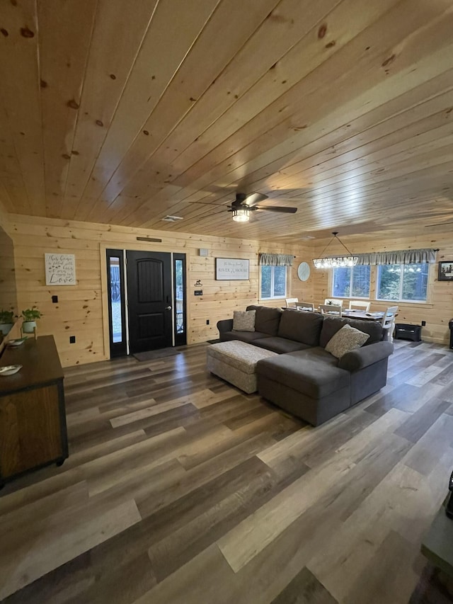 137 Maplewood Dr, Naples, ME 04055 - living area featuring wooden walls, wooden ceiling, wood finished floors, and a ceiling fan