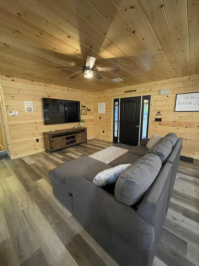 137 Maplewood Dr, Naples, ME 04055 - living area with wooden ceiling, wood walls, wood finished floors, and a ceiling fan