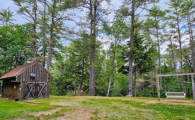 137 Maplewood Dr, Naples, ME 04055 - view of yard featuring fence, an outdoor structure, and a storage shed