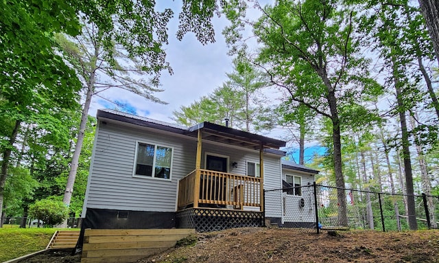 137 Maplewood Dr, Naples, ME 04055 - view of front of property featuring fence and a wooden deck