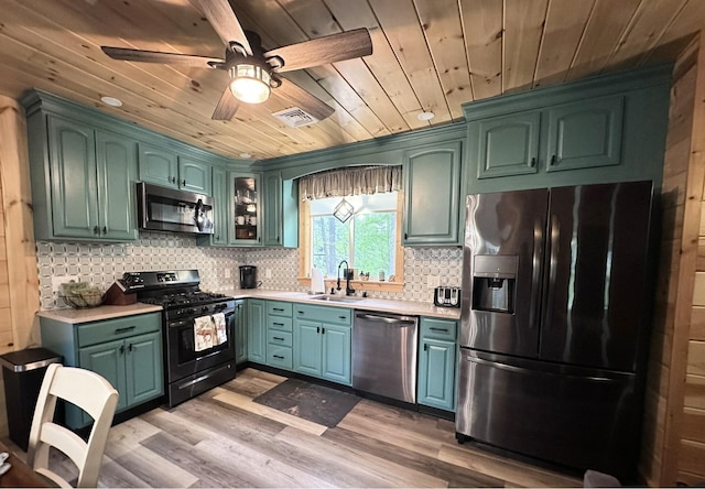 137 Maplewood Dr, Naples, ME 04055 - kitchen featuring appliances with stainless steel finishes, wood ceiling, a sink, light countertops, and a ceiling fan