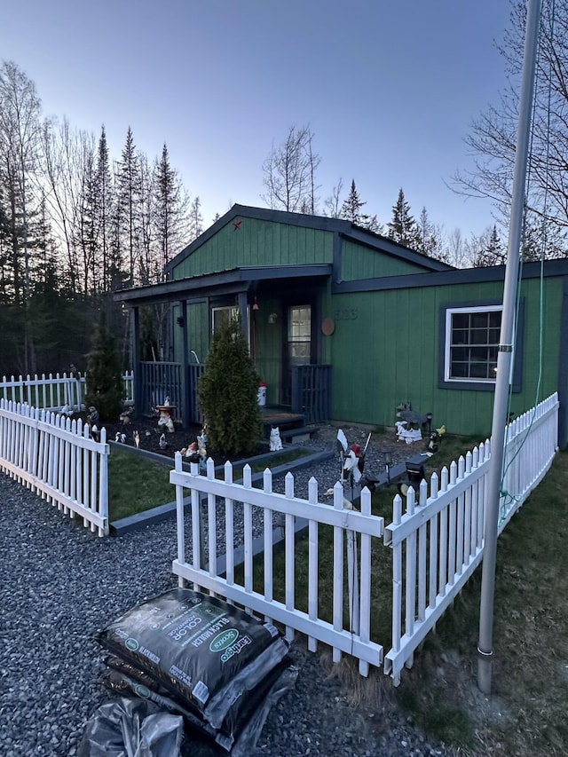 view of front of house featuring fence