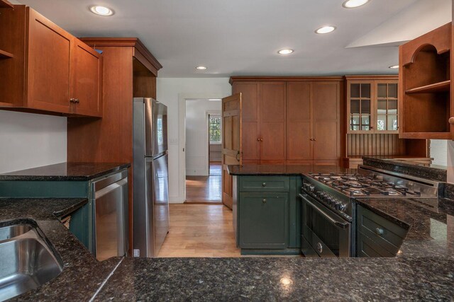 258 River Rd, Eliot, ME 03903 - kitchen featuring dark stone counters, recessed lighting, open shelves, and appliances with stainless steel finishes