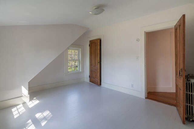 258 River Rd, Eliot, ME 03903 - additional living space with wood finished floors and lofted ceiling
