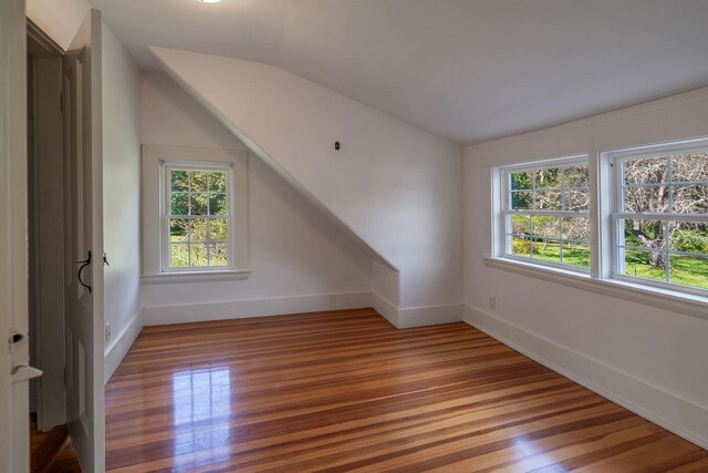 258 River Rd, Eliot, ME 03903 - bonus room with baseboards, vaulted ceiling, and light wood-type flooring