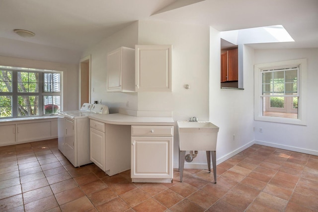 258 River Rd, Eliot, ME 03903 - washroom with cabinet space, a skylight, washing machine and dryer, and baseboards