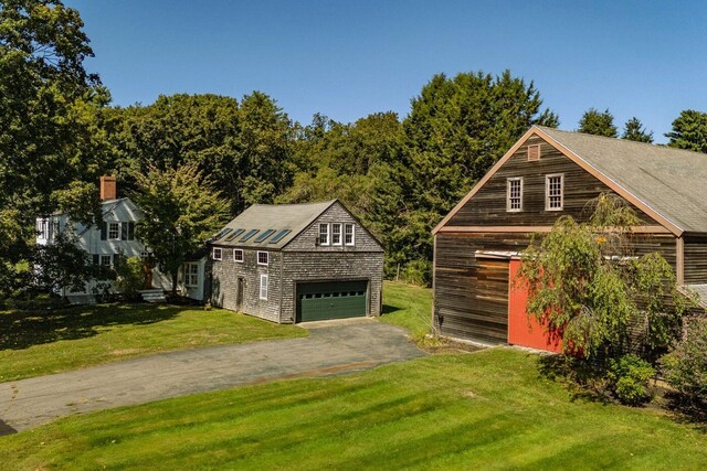 258 River Rd, Eliot, ME 03903 - garage with a detached garage and aphalt driveway