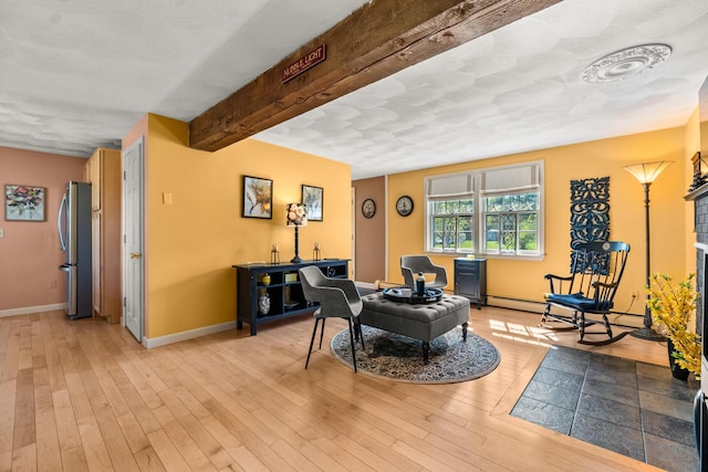 31 Saltwater Dr, York, ME 03909 - living room with baseboards, beamed ceiling, and light wood-style floors