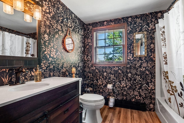 31 Saltwater Dr, York, ME 03909 - bathroom with wallpapered walls, wood finished floors, toilet, and vanity