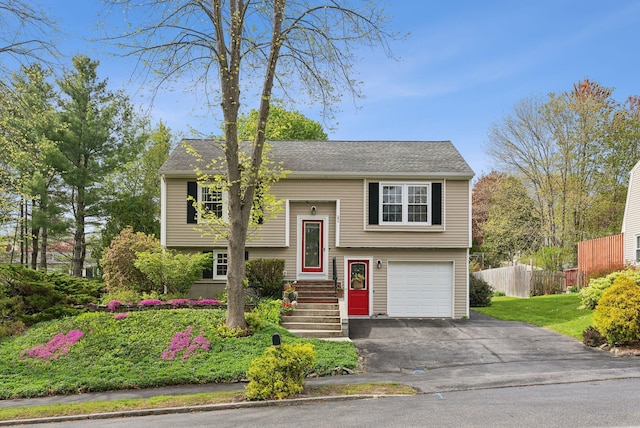 171 Regan Ln, Portland, ME 04103 - bi-level home featuring fence, asphalt driveway, and an attached garage
