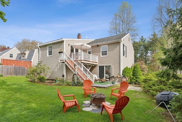 171 Regan Ln, Portland, ME 04103 - rear view of house featuring an outdoor fire pit, a deck, a chimney, and stairs