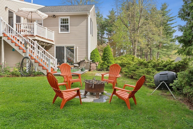 171 Regan Ln, Portland, ME 04103 - back of house with a fire pit, stairs, a deck, a yard, and a shingled roof