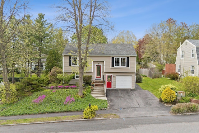 171 Regan Ln, Portland, ME 04103 - raised ranch featuring driveway, an attached garage, and a shingled roof