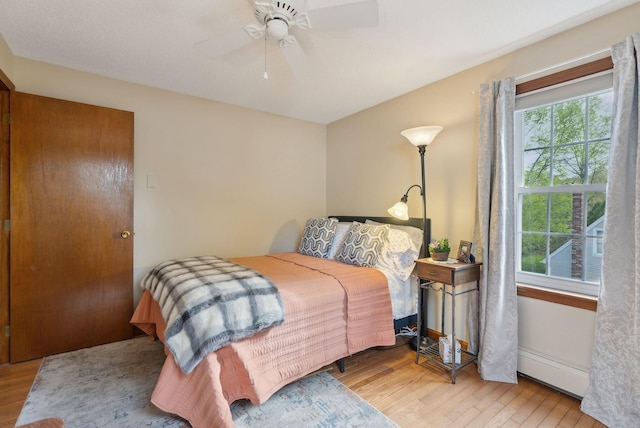 171 Regan Ln, Portland, ME 04103 - bedroom with a baseboard radiator, wood finished floors, and ceiling fan