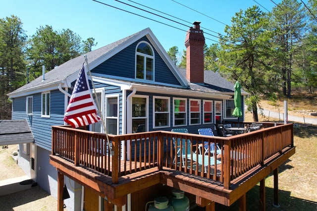 372 Pine Springs Rd, Shapleigh, ME 04076 - back of house with a deck, a chimney, and roof with shingles