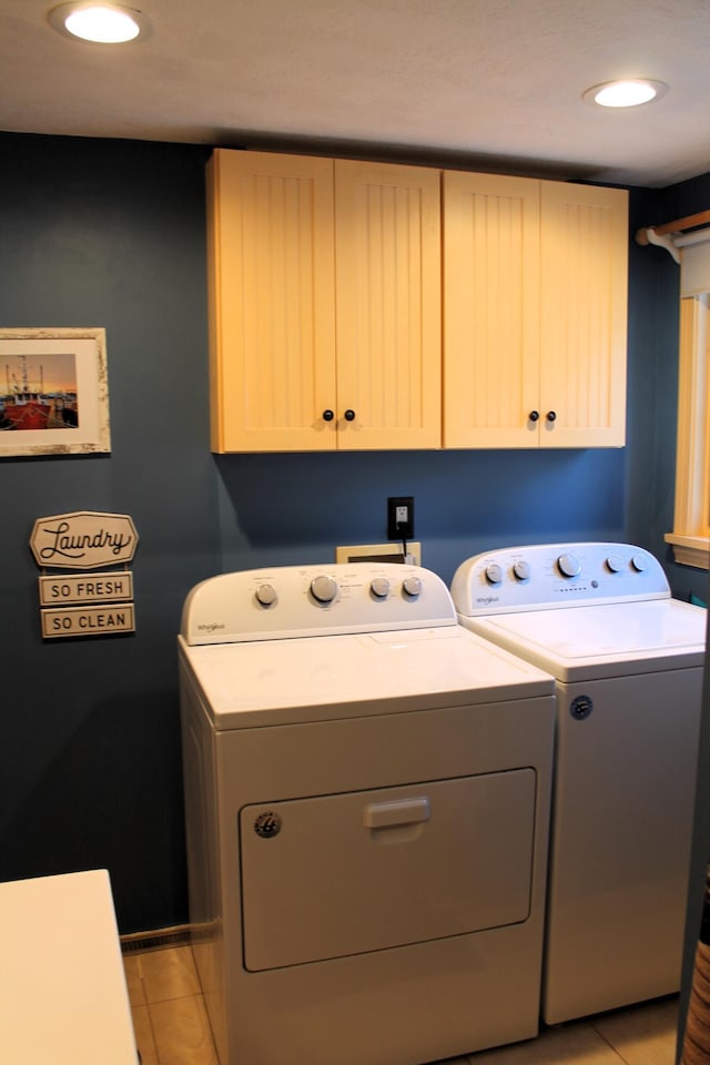 372 Pine Springs Rd, Shapleigh, ME 04076 - laundry area featuring cabinet space, washer and dryer, and light tile patterned flooring