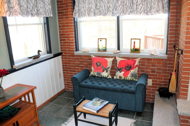 372 Pine Springs Rd, Shapleigh, ME 04076 - tiled living room with healthy amount of natural light and wainscoting