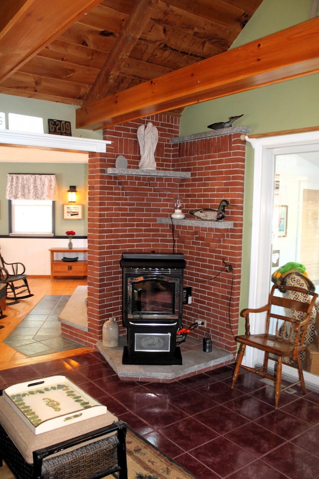 372 Pine Springs Rd, Shapleigh, ME 04076 - living room with a wood stove, wooden ceiling, and tile patterned flooring