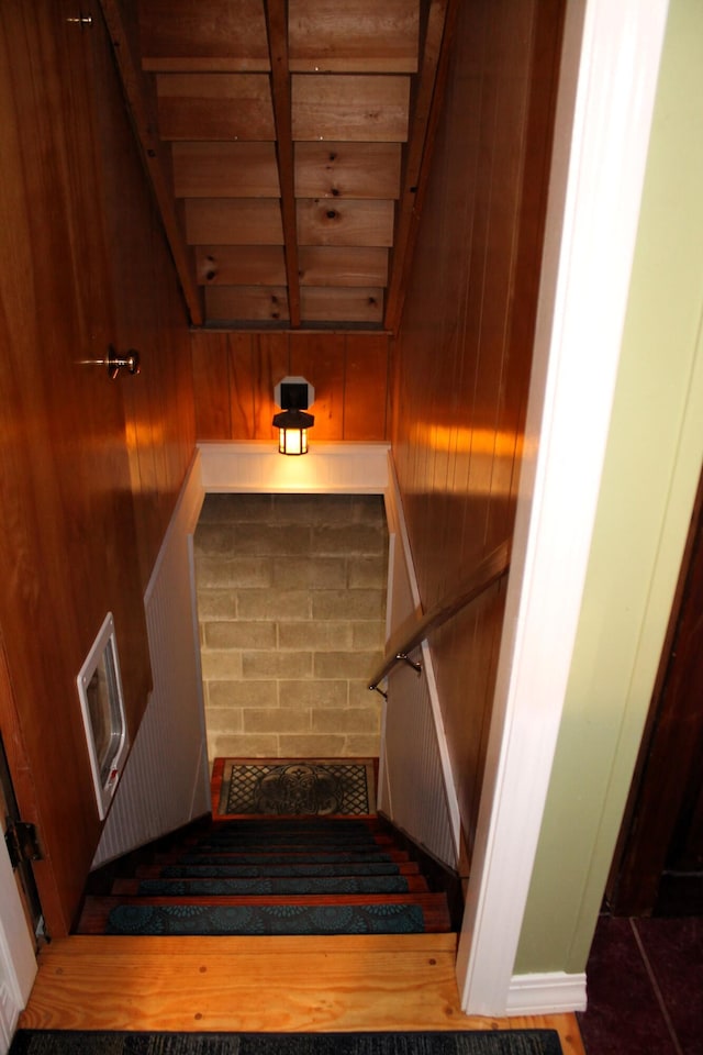 372 Pine Springs Rd, Shapleigh, ME 04076 - stairs featuring wood walls and a wood ceiling with exposed beams