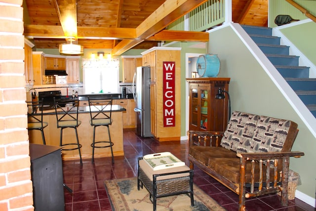 372 Pine Springs Rd, Shapleigh, ME 04076 - living room featuring dark tile patterned flooring, stairway, and a wooden ceiling with exposed beams