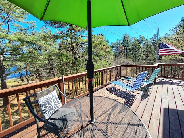 372 Pine Springs Rd, Shapleigh, ME 04076 - wooden deck with outdoor dining space