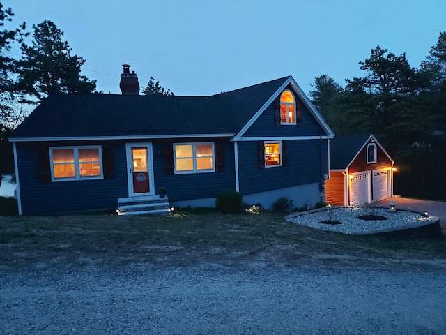 372 Pine Springs Rd, Shapleigh, ME 04076 - view of front of house featuring an outbuilding, a chimney, entry steps, and a detached garage