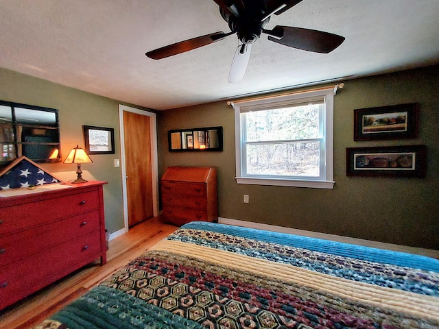 372 Pine Springs Rd, Shapleigh, ME 04076 - bedroom with light wood-type flooring and ceiling fan