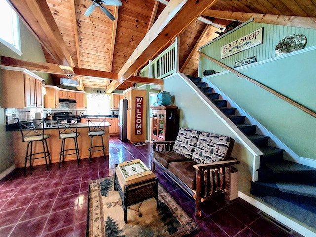 372 Pine Springs Rd, Shapleigh, ME 04076 - living area featuring wooden ceiling, stairway, dark tile patterned floors, and a ceiling fan