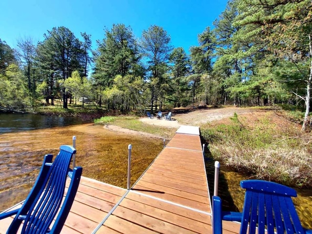 372 Pine Springs Rd, Shapleigh, ME 04076 - dock with view of scattered trees