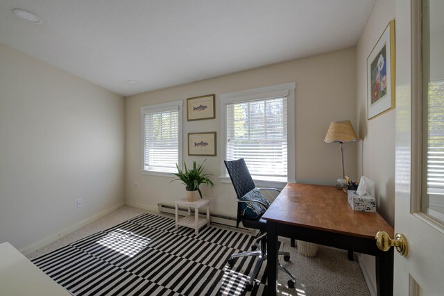 carpeted home office featuring baseboards and a baseboard heating unit