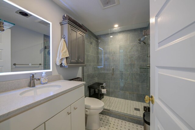full bath with visible vents, vanity, toilet, recessed lighting, and a stall shower