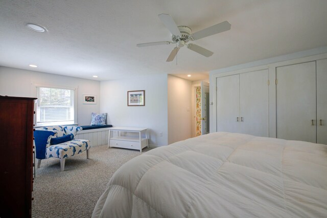 bedroom with carpet floors, recessed lighting, a ceiling fan, and multiple closets