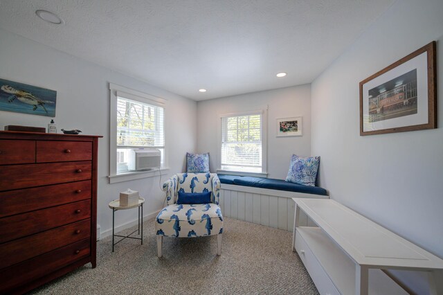 living area with recessed lighting and carpet
