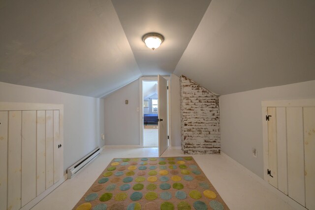 bonus room with a baseboard radiator and vaulted ceiling