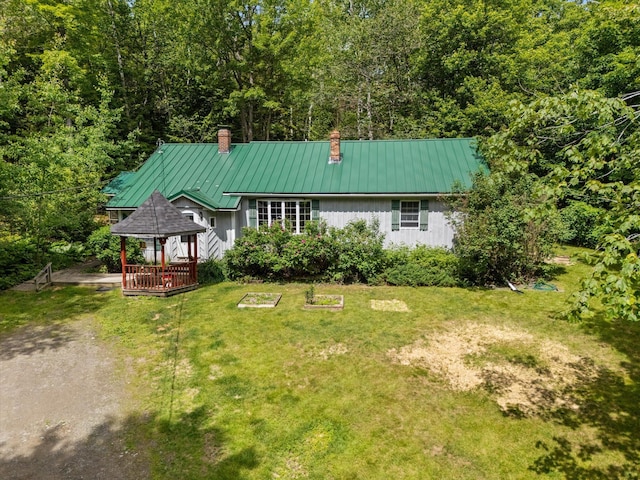 95 Hatcase Pond Rd, Eddington, ME 04428 - view of front of property with a gazebo, a chimney, a metal roof, and a front yard