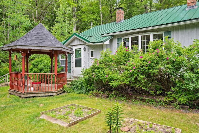 95 Hatcase Pond Rd, Eddington, ME 04428 - view of green lawn featuring a gazebo, a vegetable garden, and a deck