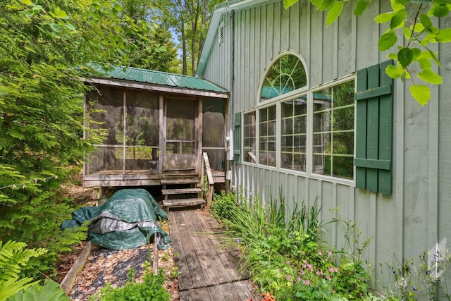 95 Hatcase Pond Rd, Eddington, ME 04428 - view of property exterior with a sunroom and a metal roof