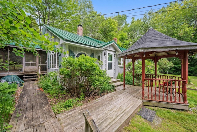 95 Hatcase Pond Rd, Eddington, ME 04428 - wooden deck featuring a gazebo and a sunroom