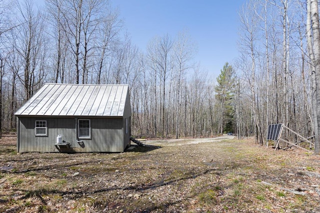 exterior space featuring a view of trees