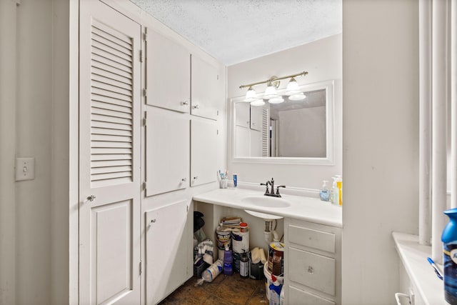1654 Carl Broggi Hwy, Lebanon, ME 04027 - bathroom featuring vanity and a textured ceiling