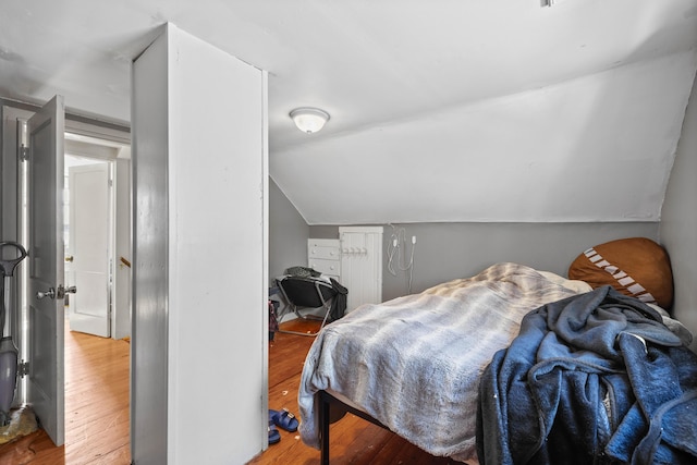 1654 Carl Broggi Hwy, Lebanon, ME 04027 - bedroom featuring lofted ceiling and wood finished floors