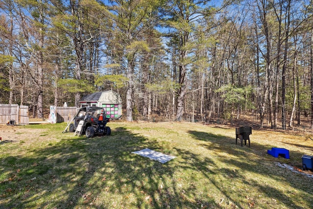 1654 Carl Broggi Hwy, Lebanon, ME 04027 - view of yard with fence, an outbuilding, and a storage unit