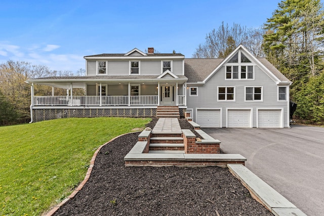 319 Harris Rd, Cumberland, ME 04021 - view of front facade with an attached garage, a chimney, driveway, covered porch, and a front yard